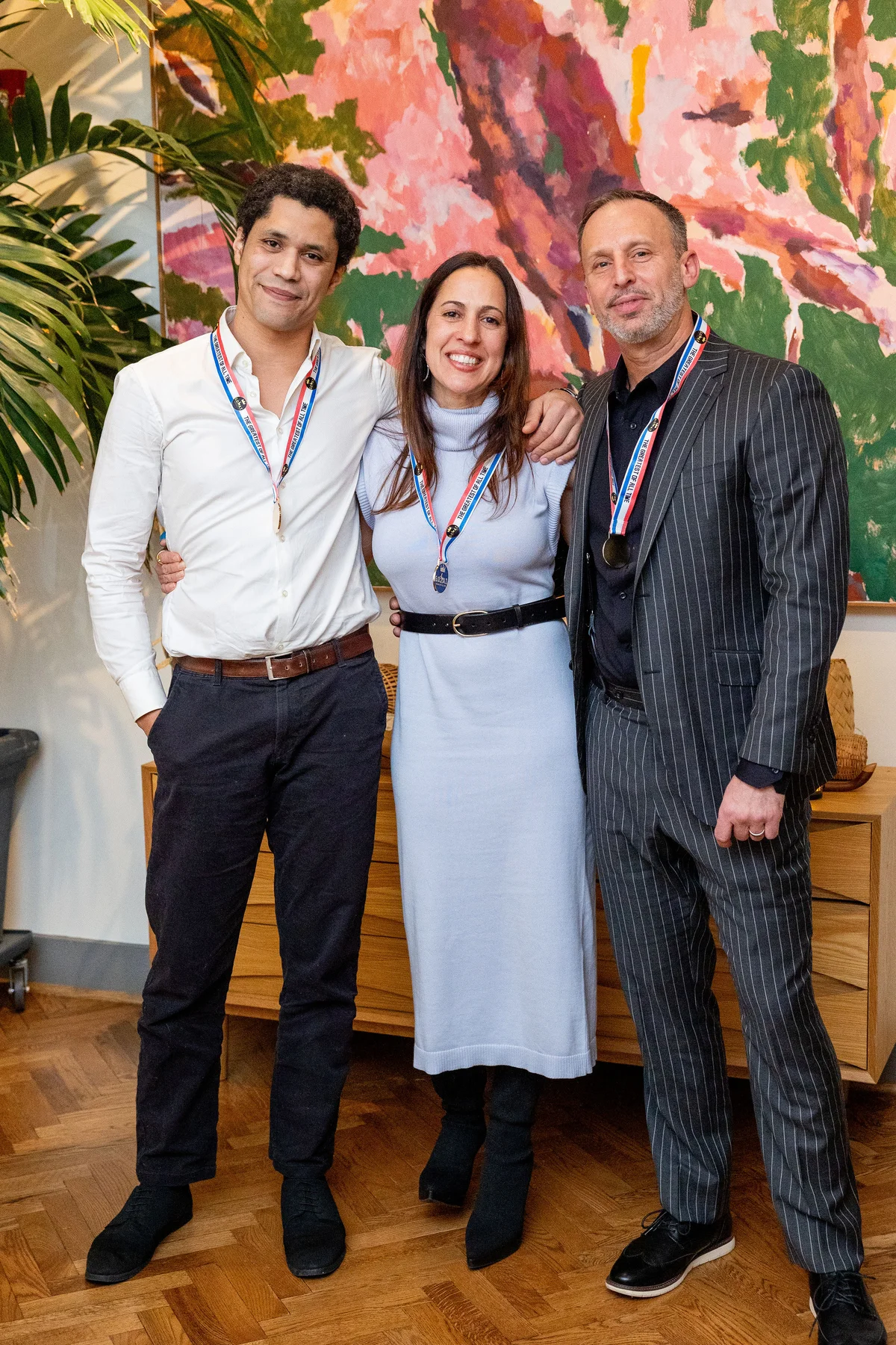 RareMoon founders wearing their GOAT medals